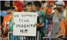  ?? Photograph: Jim Rassol/MCT via Getty Images ?? A fan holds a sign in support of Richie Incognito during the Dolphins’ bullying scandal.