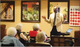  ?? Ryan Mancini/The Signal ?? Pastor Carthel Towns speaks to Pacifica Senior Living residents during church services Sunday. Ekklesia has services there the second and fourth Sundays of the month.