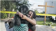  ?? JOE RAEDLE/GETTY IMAGES ?? Kearston Farr comforts her daughter, Taliyah Farr after the shootings.