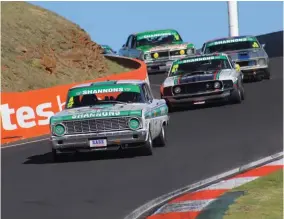  ??  ?? Long-time Classic Driver subscriber Jim Richards in his Falcon leads the Touring Car Master field through The Dipper at the top of Mt Panorama