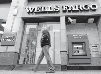  ?? Associated Press file ?? The Federal Reserve is imposing more penalties on Wells Fargo, freezing the bank’s growth until it can prove it has improved its internal controls.