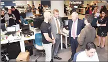  ??  ?? Britain’s Foreign Minister Boris Johnson (second right), speaks with PayDock CEO Robert Lincolne (left), British Consul-General Michael Ward (second left), and head of Tyro Fintech Hub Andrew Corbett-Jones (right), during a visit to the Tyro Fintech...