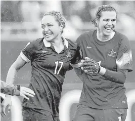  ?? Franck Fife / Getty Images ?? Australian forward Kyah Simon, left, scored the only goal against Brazil in the tournament; goalkeeper Lydia Williams kept Marta & Co. at bay Sunday.