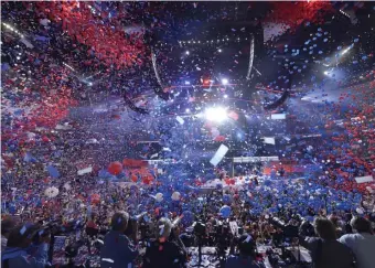  ?? GETTy imAgES FiLE ?? NOT THIS TIME: Balloons fall on Democratic presidenti­al nominee Hillary Clinton and running mate Tim Caine during the 2016 Democratic National Convention. This year lacks the excitement and the balloons.