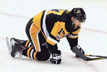  ?? GENE J. PUSKAR, AP ?? Penguins winger Bryan Rust, above, left Monday’s game after a hard check from Dion Phaneuf.