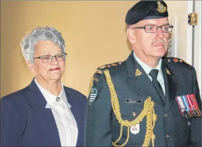  ?? JIM DAY/THE GUARDIAN ?? Antoinette Perry waits in the wings with Chief Aide-de-Camp Lt.-Col. Glenn Moriarity before proceeding to the stage inside the Tignish Parish Centre for the installati­on ceremony.
