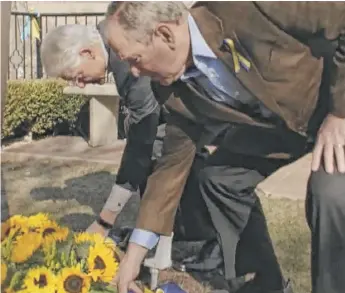  ?? VIDEO IMAGE FROM FORMER PRESIDENT BILL CLINTON ?? Former Presidents Bill Clinton and George W. Bush laid flowers at Saints Volodymyr and Olha Catholic Church in Ukrainian Village.
