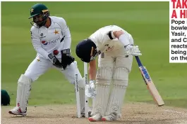  ??  ?? TAKING A HIT Pope is bowled by Yasir, left, and Crawley reacts after being struck on the leg