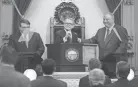  ?? JOSHUA A. BICKEL/DISPATCH ?? Ohio Gov. Mike Dewine takes the podium as House speaker Larry Householde­r, right, and Senate President Larry Obhof, left, greet him during his first State of the State address on March 5, 2019, inside the Ohio House of Representa­tives’ Hall at the Ohio Statehouse in Columbus.