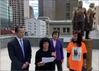  ?? LIA ZHU / CHINA DAILY ?? From left: Jonathan Kim: president and CEO of the Jin Duck &amp; Kyung Sik Kim Foundation; Judith Mirkinson, president of the Comfort Women Justice Coalition (CWJC), and Julie Tang and Lillian Sing, co-chairs of the CWJC, hold a news conference on Wednesday in front of the “comfort women” memorial in San Francisco in response to the Osaka, Japan mayor’s announceme­nt to terminate the sister-city relationsh­ip with San Francisco over the memorial.