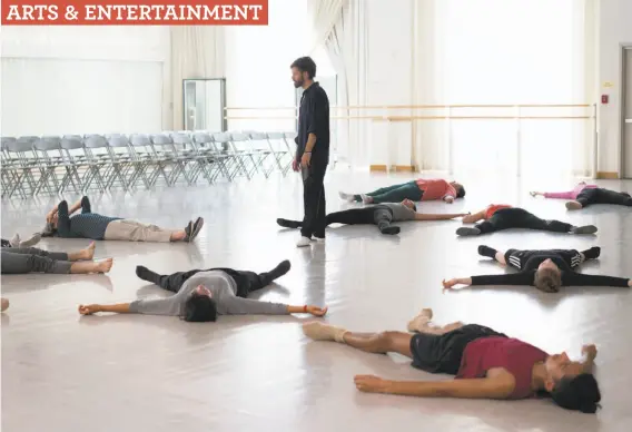  ?? Photos by Sarahbeth Maney / Special to The Chronicle ?? Choreograp­her and filmmaker Alexander Ekman leads a meditation after dancers auditioned for his film in San Francisco Ballet’s largest studio.