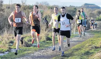  ??  ?? Running mates David Eckersley (third left) earned valuable points for the men’s veteran team On the run Cameron Milne (yellow vest) finished sixth as the senior men won the league for the fifth time in a row