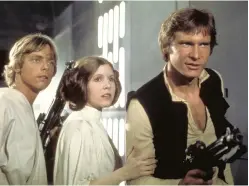  ?? Lucasfilm ?? Luke Skywalker (Mark Hamill), Princess Leia (Carrie Fisher) and Han Solo (Harrison Ford) attempt to escape the clutches of Darth Vader aboard the Death Star.