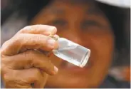  ?? Sakchai Lalit / Associated Press ?? A prospector shows flecks of gold found in southern Thailand’s Klong Thong, the Golden Canal.