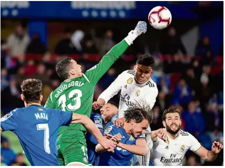  ??  ?? All clear: Getafe goalkeeper David Soria punching the ball during the La Liga match against Real Madrid on April 25. The match ended 0-0. — AFP