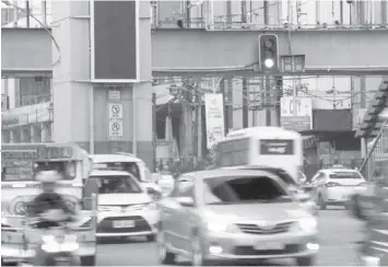  ?? PHILSTAR.COM ?? Motorists drive through various intersecti­ons in Cubao, Quezon City on Tuesday, Aug. 2, 2022. The Metro Manila Developmen­t Authority is set to upgrade the traffic control system in Metro Manila that operates based on an intersecti­on's volume of vehicles.