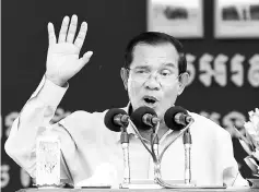  ??  ?? Hun Sen speaks during a visit to a garment factory in Phnom Penh.