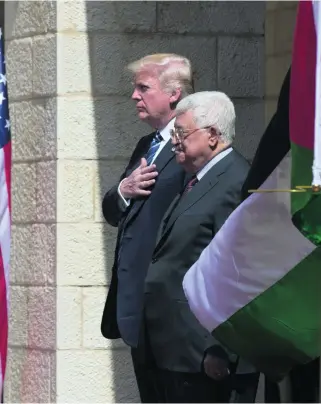  ?? Heidi Levine for The National ?? Donald Trump and Palestinia­n leader Mahmoud Abbas in the West Bank city of Bethlehem yesterday. ‘Peace is a choice we must make each day,’ the US president said after the talks.