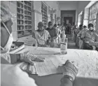  ?? MAHESH KUMAR A./AP ?? People wait to be vaccinated in Hyderabad, India, Monday. The cases reported Monday pushed India’s total to 13.5 million.