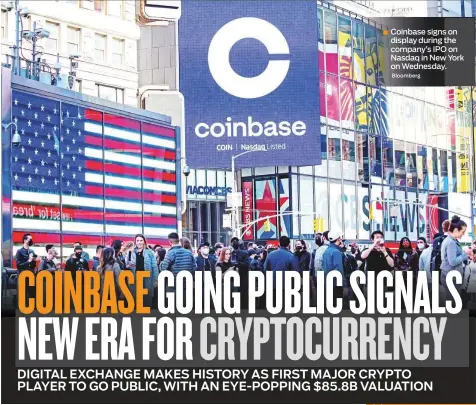  ?? Bloomberg ?? Coinbase signs on display during the company’s IPO on Nasdaq in New York on Wednesday.