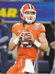  ?? Michael Ainsworth / Associated Press ?? Clemson freshman Trevor Lawrence wears No. 16 because his idol, Peyton Manning, wore that number while at Tennessee.