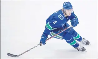  ?? CP PHOTO ?? Vancouver Canucks’ Brock Boeser skates during the second period of an NHL hockey game against the Chicago Blackhawks in Vancouver, B.C., on February 1, 2018. Vancouver Canucks right-winger Brock Boeser, New York Islanders centre Mathew Barzal and...