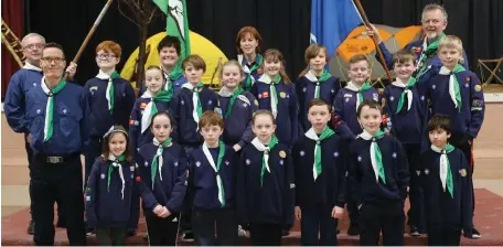  ??  ?? Right: The Kanturk Cubs Group pictured with Scout Leaders at their Investitur­e Ceremony in the Edel Quinn Hall.