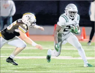  ?? ANDA CHU — STAFF PHOTOGRAPH­ER ?? De La Salle’s Shamar Garrett (148 yards rushing), right, made big plays on offense and defense to help the Spartans hold off St. Francis 33-15 on Friday night.