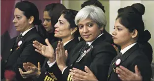  ?? VIPIN KUMAR Hindustan Times ?? KSHAMTA BAJPAI, second from right, cheers her Air India team, which set a world record in 2017 by flying a Boeing 777 around the world with an all-female cockpit and cabin crew.