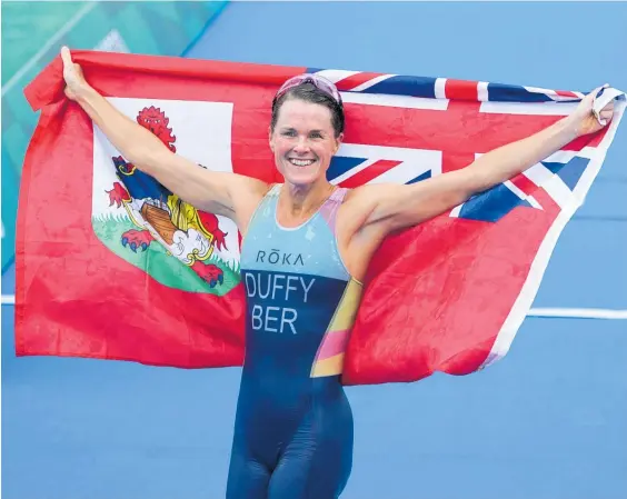  ?? Photo / AP ?? Flora Duffy celebrates winning Bermuda’s first Olympic gold medal yesterday in the women’s triathlon.