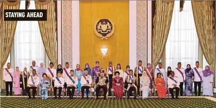  ?? BERNAMA PIC ?? Yang di-Pertuan Agong Sultan Muhammad V with award recipients at Istana Negara in Kuala Lumpur yesterday. With the king is Prime Minister Datuk Seri Najib Razak.