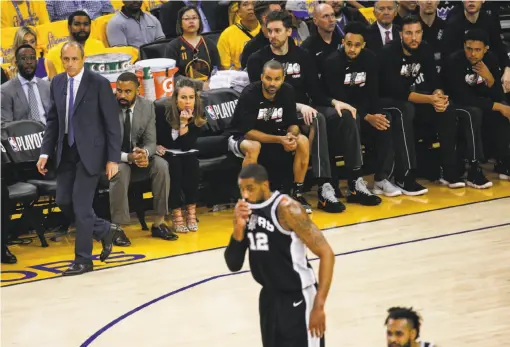  ?? Santiago Mejia / The Chronicle ?? San Antonio assistant coach Ettore Messina, subbing for the absent Gregg Popovich, stalks the sideline in the first quarter during Game 5 at Oracle Arena. The Spurs fell behind 9-0 and trailed by as many as 16 before cutting the deficit to two in the...