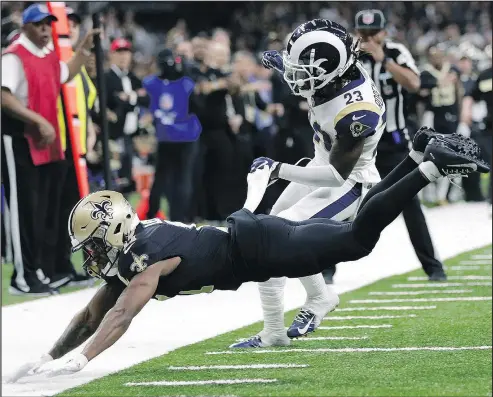  ?? — ASSOCIATED PRESS ?? Saints wide receiver Tommylee Lewis falls after getting roughed up by Rams defensive back Nickell Robey-Coleman on Sunday. A pass interferen­ce call was not made, but clearly should have been. The Rams won 26-23.