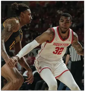  ?? (AP/Kevin M. Cox) ?? Houston forward Reggie Chaney (right) played at the University of Arkansas before transferri­ng to Houston, where he has developed into one of the top-seeded Cougars’ best players.