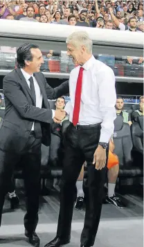  ?? Picture: GETTY IMAGES ?? VERY WELCOMING: Former Paris Saint-Germain manager Unai Emery, left, has been confirmed as Arsene Wenger’s replacemen­t at Arsenal this week