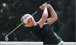  ?? AP PHOTO/STEVE DYKES ?? Brooke Henderson, of Canada, hits her tee shot on the second hole during the final round of the Cambia Portland Classic golf tournament in Portland, Ore., Sunday.