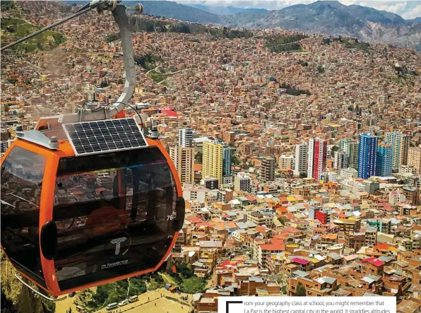  ??  ?? Above: La Paz is in fact two cities: the city centre which covers the lower areas and El Alto, a large urban sprawl on the edge of the Altiplano. The world’s longest urban cable car network connects the two.
Below: Every day is market day in La Paz – you can buy everything from fresh fruit to muti.