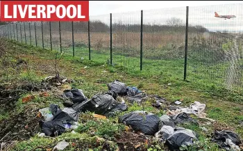  ??  ?? LIVERPOOL
Sea of binbags: Sacks of litter dumped at Liverpool John Lennon Airport