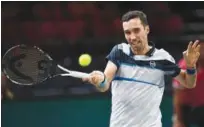  ?? Reuters ?? Kazakhstan’s Mikhail Kukushkin returns the ball to France’s Pierre-hugues Herbert during their first round match of the ATP World Tour Masters on Tuesday.