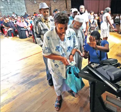  ?? Picture: WILLEM LAW ?? DEPENDENT: Pensioners queue at Cape Town’s Athlone Civic Centre waiting to receive their social grant payouts.