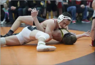  ?? JEN FORBUS — FOR THE MORNING JOURNAL ?? Lutheran West’s Parker Watson pinned Hunter Yeaples of Black River in the 138 pound weight class championsh­ip bout on Feb. 9.