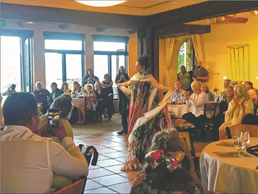  ?? Julianna Velar ?? A model wears a dress designed by Patricia Michaels of Taos Pueblo at the fundraiser for Big Brothers, Big Sisters Saturday (Sept. 1) at the Taos Country Club.