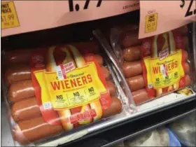  ?? PHOTOS BY CANDICE CHOI — ASSOCIATED PRESS ?? In this June 28 photo, Oscar Mayer classic uncured wieners are for sale at a grocery store in New York. Oscar Mayer is touting its new hot dog recipe that uses nitrite derived from celery juice instead of artificial sodium nitrite, which is used to...