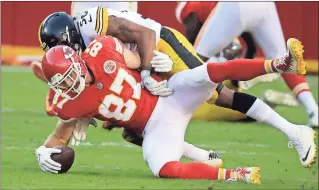  ?? File, Charlie Riedel / The Associated Press ?? Kansas City’s Travis Kelce (87) recovers the ball after being tackled by Pittsburgh’s Ryan Shazier on Sunday.