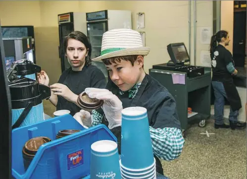  ?? Andrew Rush/Post-Gazette ?? Seneca Valley students Ashley Spielman, left, and Eric Kavanagh work at Grounds for Thought coffee shop at the senior high school.