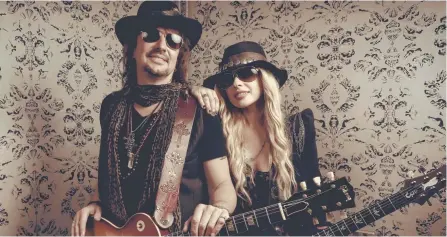  ??  ?? Australian guitarist Orianthi with former Bon Jovi guitarist Richie Sambora for their collaborat­ive project band RSO.