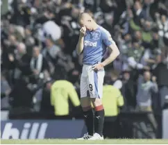  ??  ?? 0 Kenny Miller stands dejected after his cup hopes are dashed.
