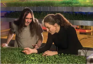  ??  ?? Above: Dr Rob Hancock shows Louise Gray the micro-herbs growing on the vertical farm.Bottom: The IGS vertical farm is a three-storey building at the James Hutton Institute, Dundee.