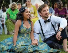  ?? Photo: Universal Pictures ?? FINDING FAMILY: Miranda Tapsell and Gwilym Lee survive a calamity-filled journey to get married in Top End Wedding.