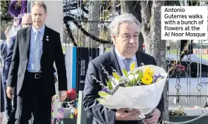  ??  ?? Antonio Guterres walks with a bunch of flowers at the Al Noor Mosque